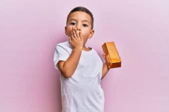 todder holds a gold bar